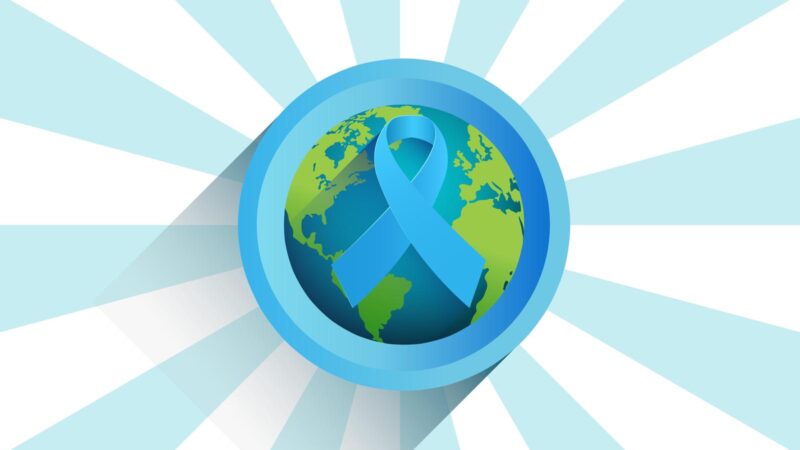 blue diabetes ribbon on the world with rays of blue coming from centre image about diabetes awareness and world diabetes day
