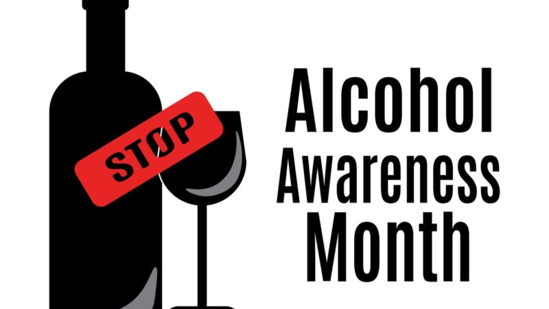 Alcohol Awareness Month Poster with black alcohol bottle and wine glass with the word stop in red stamp black type.